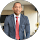 Reviewer profile photo of a man in a suit